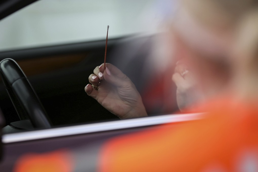 Covid-19 swab tests are conducted at a stadium in Houston in December. Photo: Houston Chronicle via AP