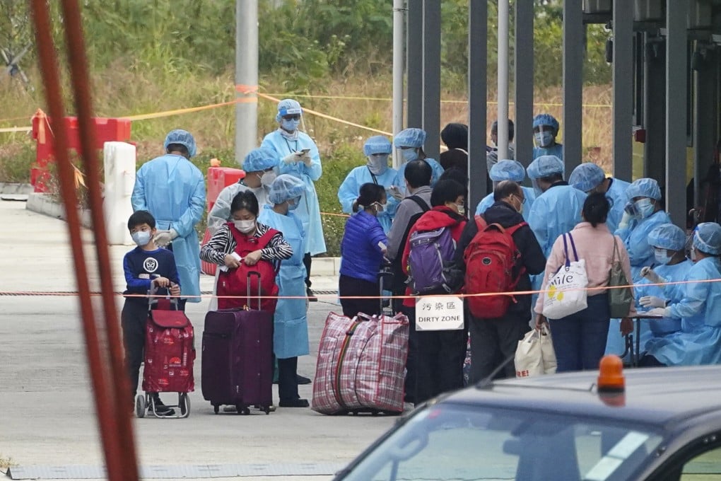 Hongkongers are ushered into the government’s quarantine facility at Penny’s Bay on Friday. Photo: Felix Wong