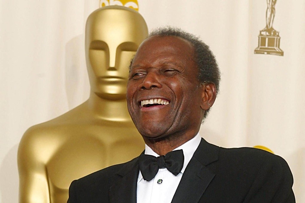 US actor Sidney Poitier holds his honorary Oscar at the 74th Academy Awards in Hollywood in March 2002. Photo: AFP