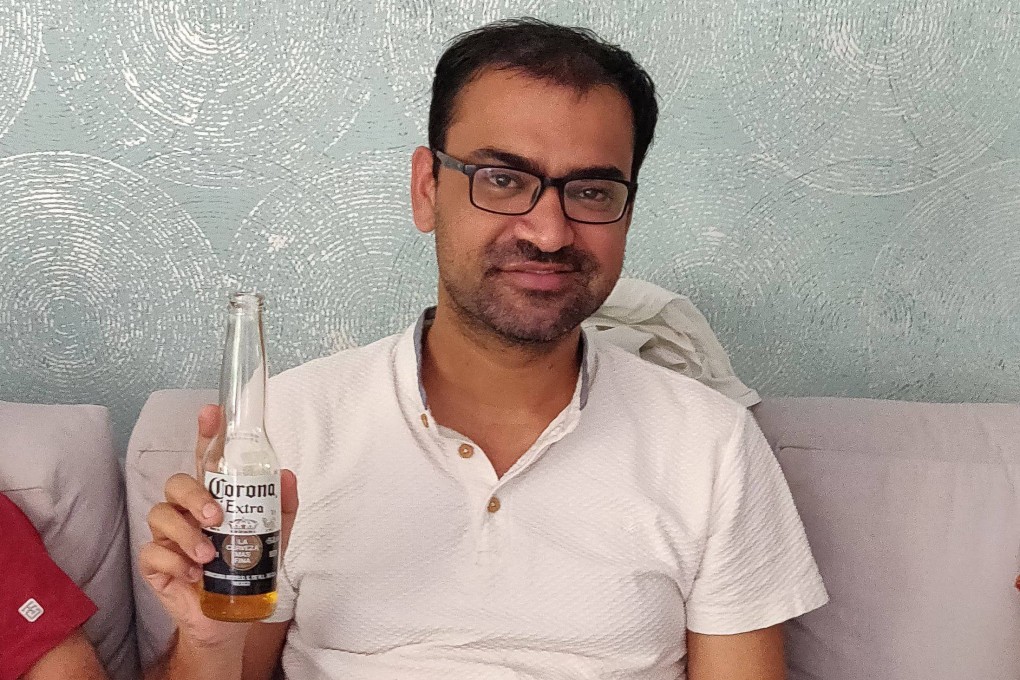 Kovid Kapoor poses for a picture while drinking a Corona beer in Mumbai. Photo: Handout via AFP