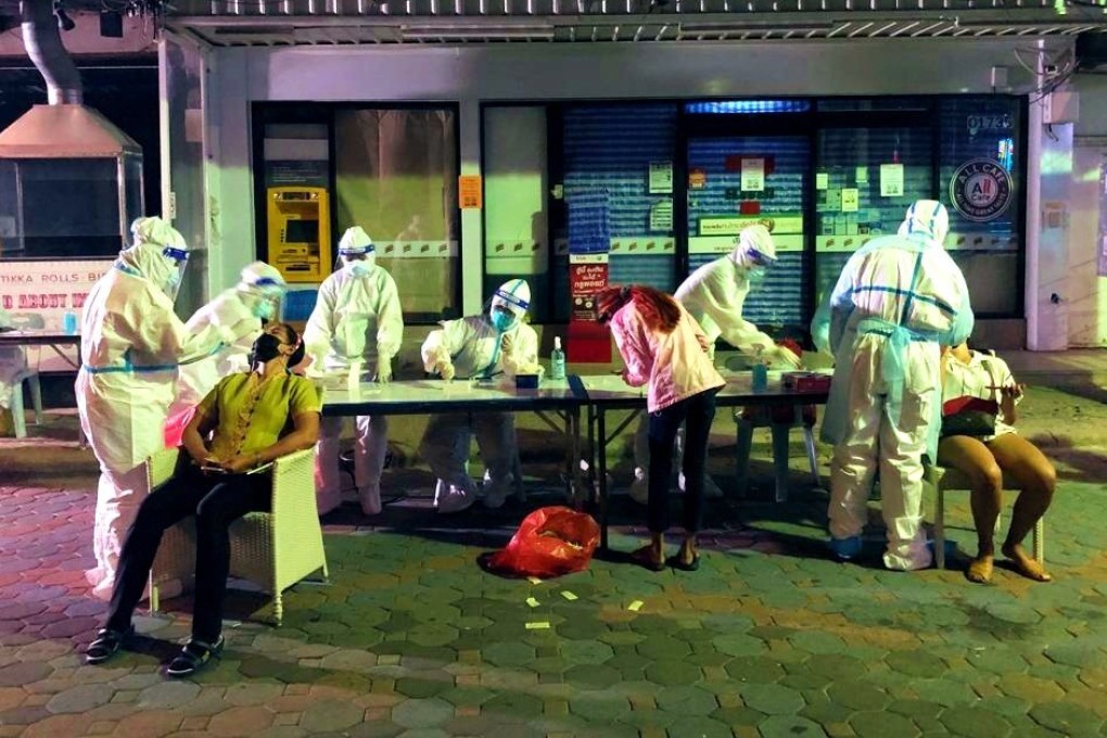 People take Covid-19 tests at Pattaya’s ‘Walking Street’. Photo: Vijitra Duangdee