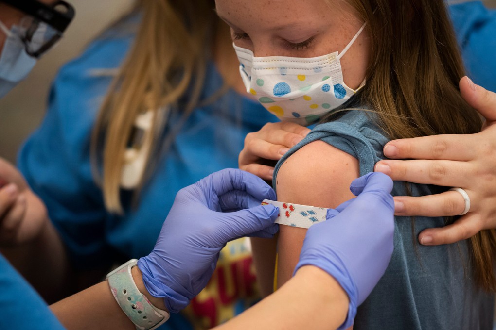 Marin Ackerman, 10, gets a bandage after receiving a dose of the Pfizer-BioNTech Covid-19 vaccine at an Ohio children’s hospital in November. Photo: TNS