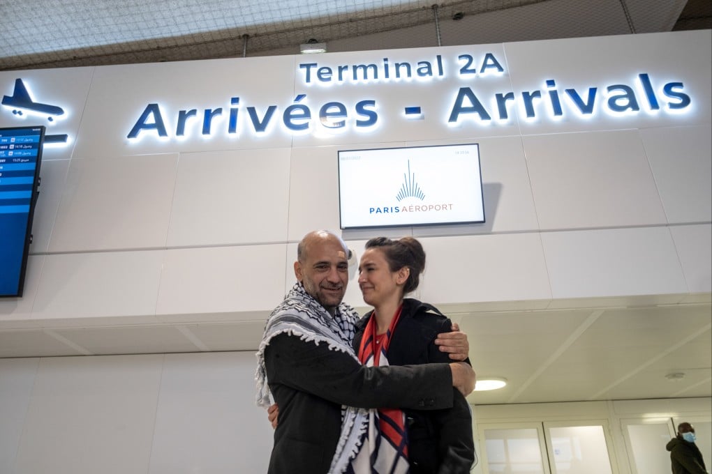 Egyptian-Palestinian political activist Ramy Shaath embraces his wife Celine Lebrun-Shaath at Paris Charles de Gaulle Airport on January 8. Photo: Le Pictorium Agency via Zuma / DPA