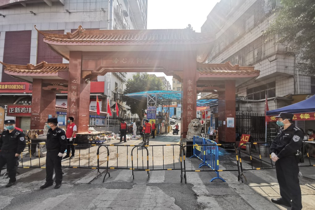 An area under temporary lockdown in Longgang district of Shenzhen, where all three cases live. Photo: Xinhua