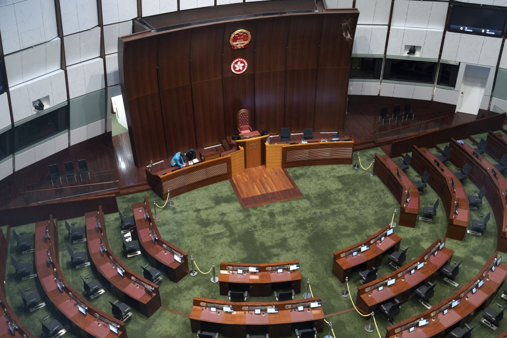 A worker on Monday readies the Legislative Council chamber for the body’s first meeting of its new term later this week. Photo: Robert Ng