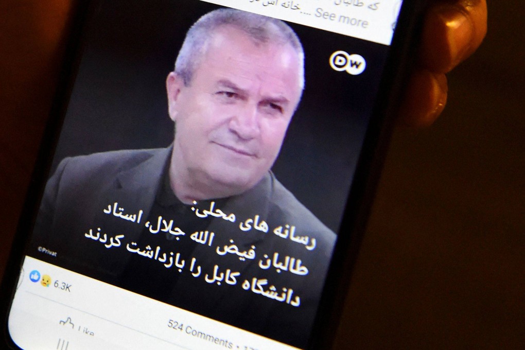 A news report on a mobile phone reporting the arrest of Afghan university professor professor Faizullah Jalal. Photo: AFP