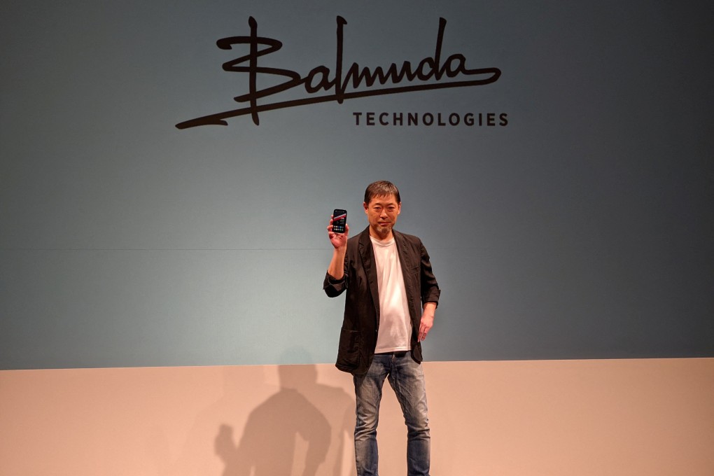 Balmuda CEO Gen Terao, whose company’s design focus was inspired by Apple’s Steve Jobs, holds the ‘Balmuda Phone’ at a news conference in Tokyo in November. Photo: Reuters