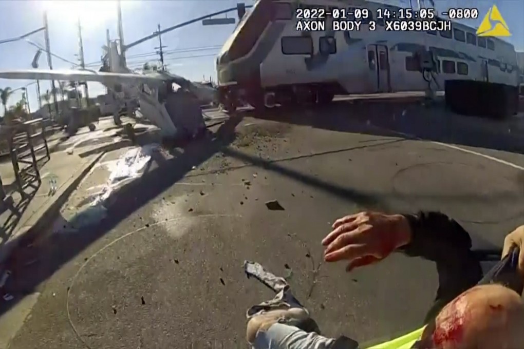 A screengrab from police bodycam footage shows a commuter train running into a plane that crash-landed in Los Angeles on Sunday. Photo: Los Angeles Police Department via AP