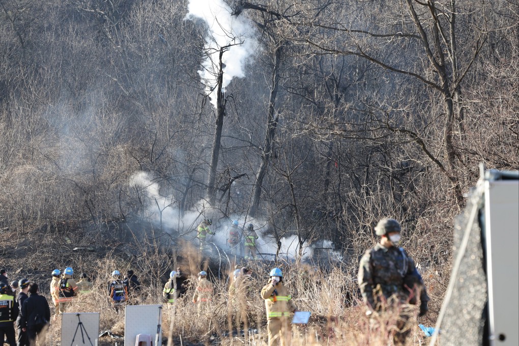 Military officials check the wreckage of a F-5E jet on a hill in Hwaseong. Photo: EPA-EFE/Yonhap