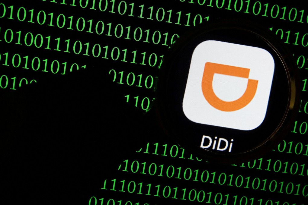 The app logo of Chinese ride-hailing giant Didi seen through a magnifying glass on a computer screen showing binary digits in this illustration picture taken July 7, 2021. Photo: Reuters