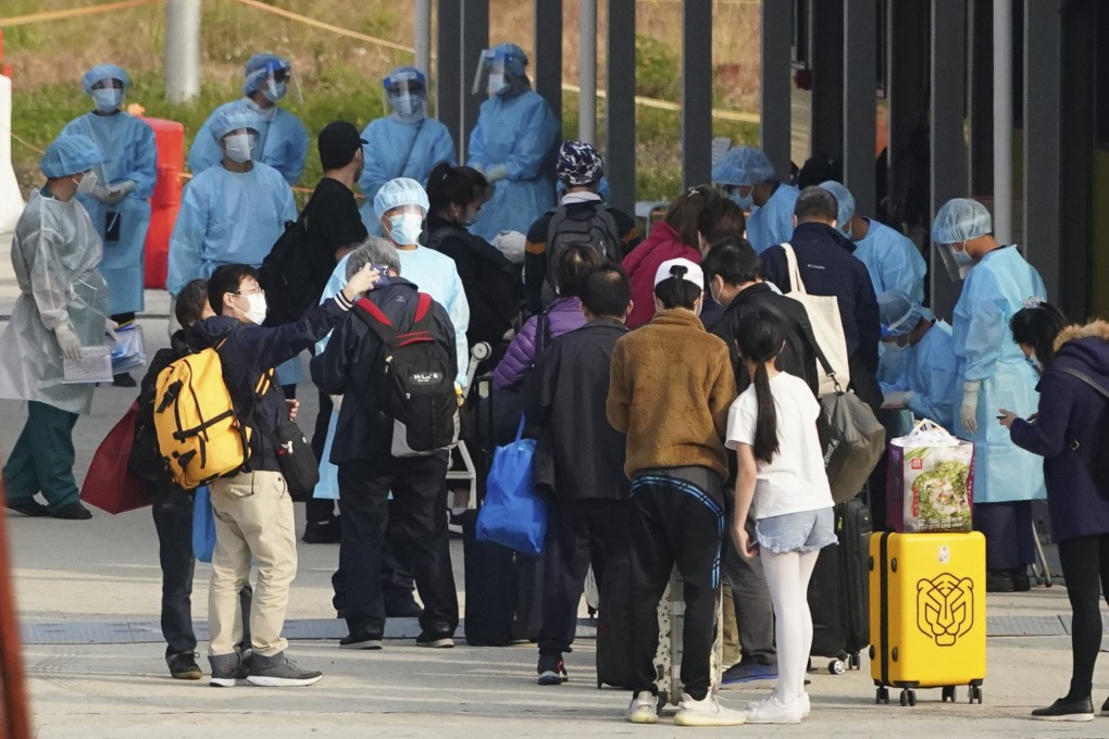 People arrive at the Penny’s Bay Quarantine Centre on Lantau Island for quarantine. Photo: Felix Wong