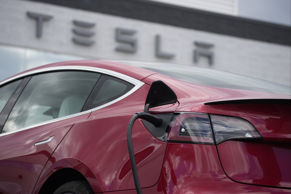 A Model 3 car charges at a Tesla dealership in the United States. Photo: AP