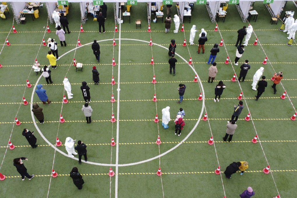 Residents line up for a second round of Covid-19 testing in Tianjin on Wednesday. Photo: AP
