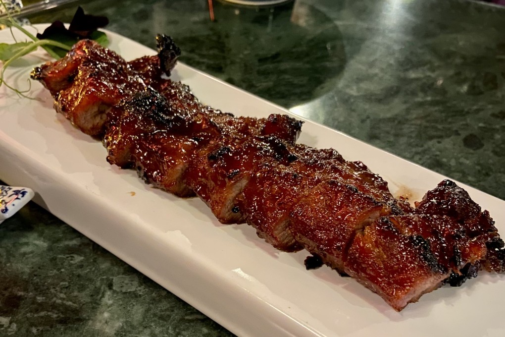 The honey-glazed barbecued pork at Woo Cheong Tea House was succulent, thickly sliced and had a nice amount of char. Photo: Susan Jung
