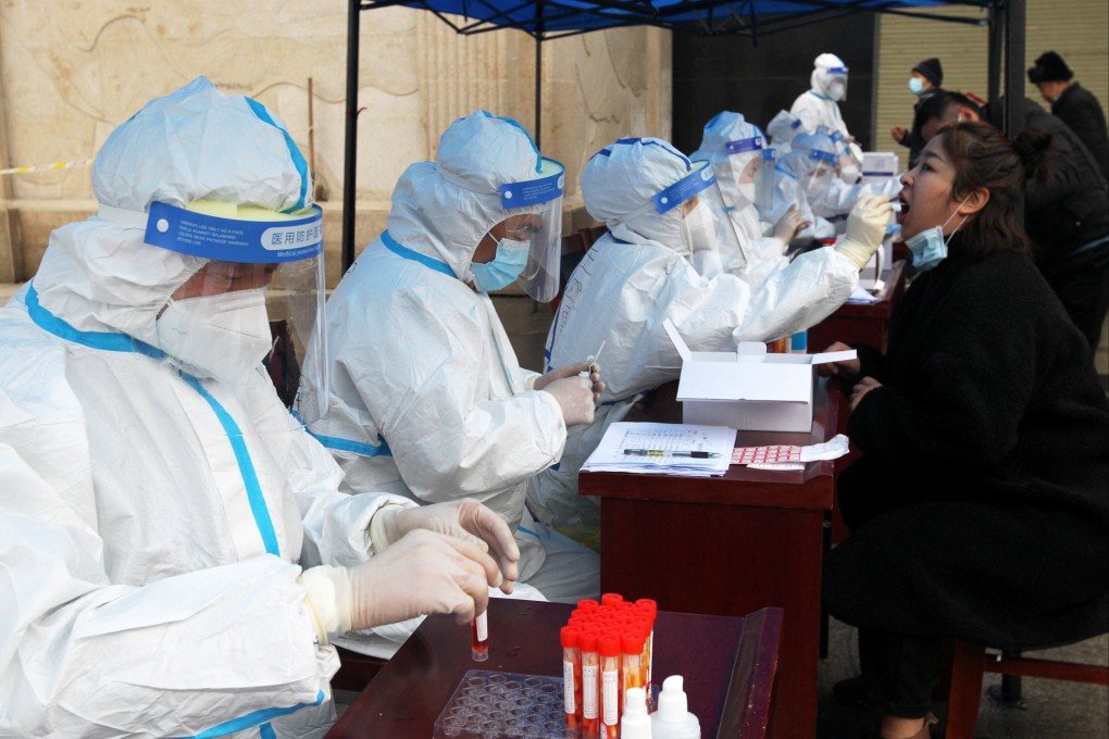 Residents get tested in Xuchang, Henan. A medical laboratory manager in the province is in custody for “suspected criminal offences”. Photo: Reuters
