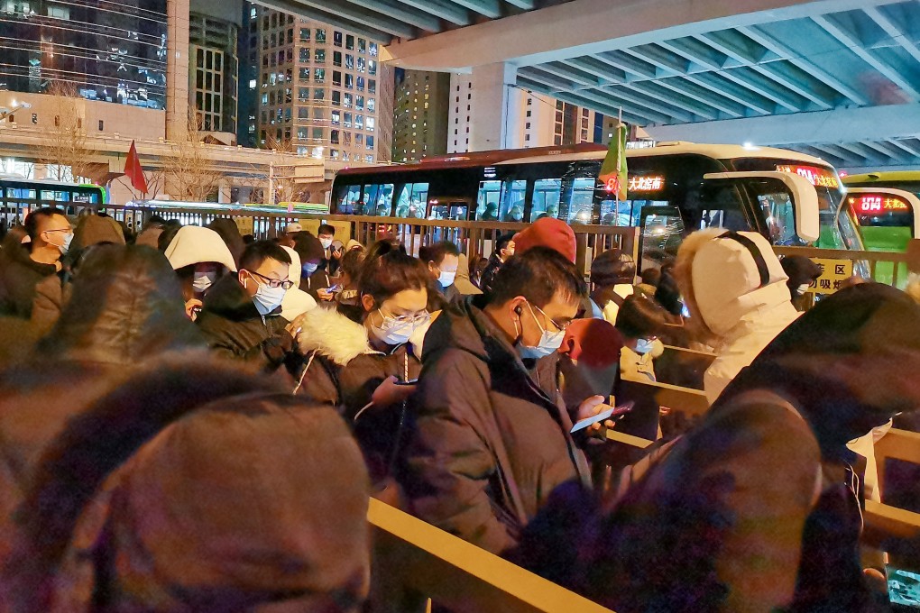 Queues snake around Guomao’s bus terminal in central Beijing as commuters wait to head home to Yanjiao. Photo: Echo Xie