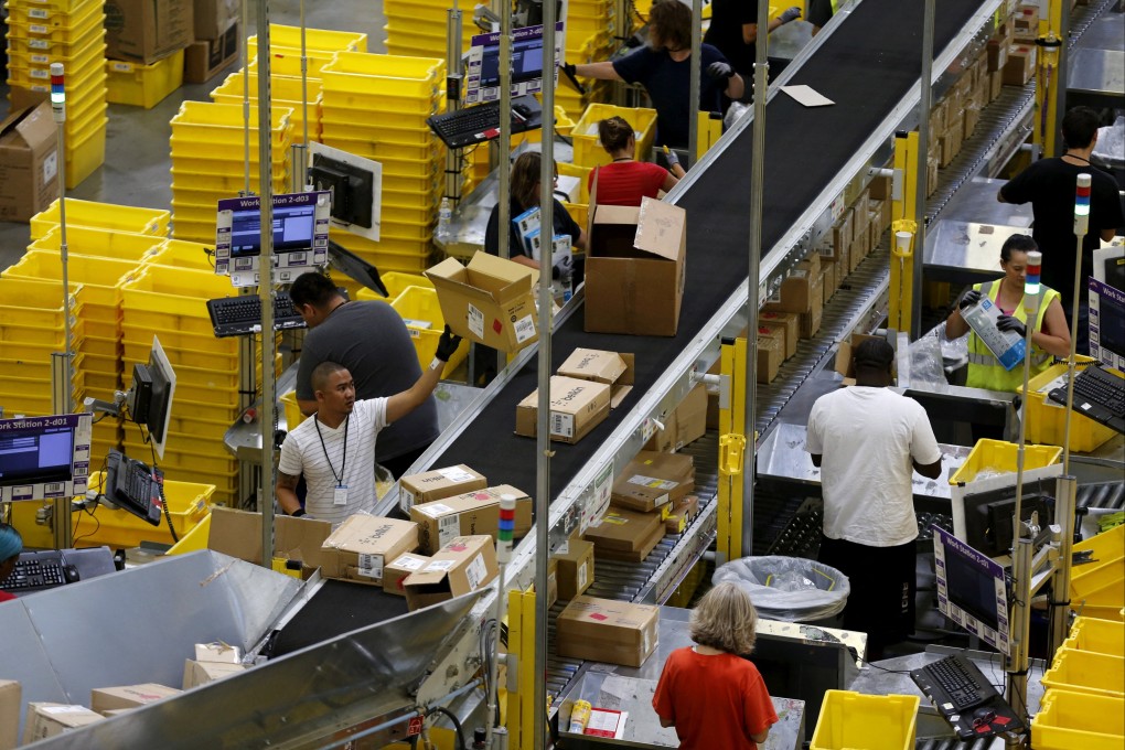 Workers sort arriving products at an Amazon Fulfilment Centre. Photo: Reuters