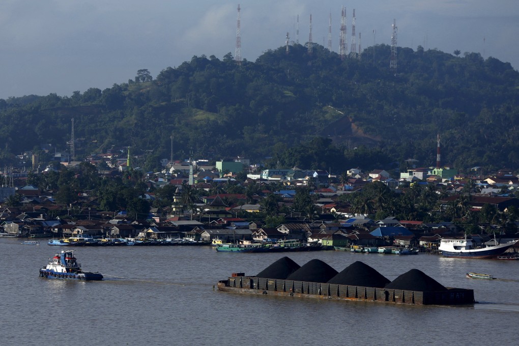 A tug boat pulls a coal barge in Indonesia. Photo: Reuters