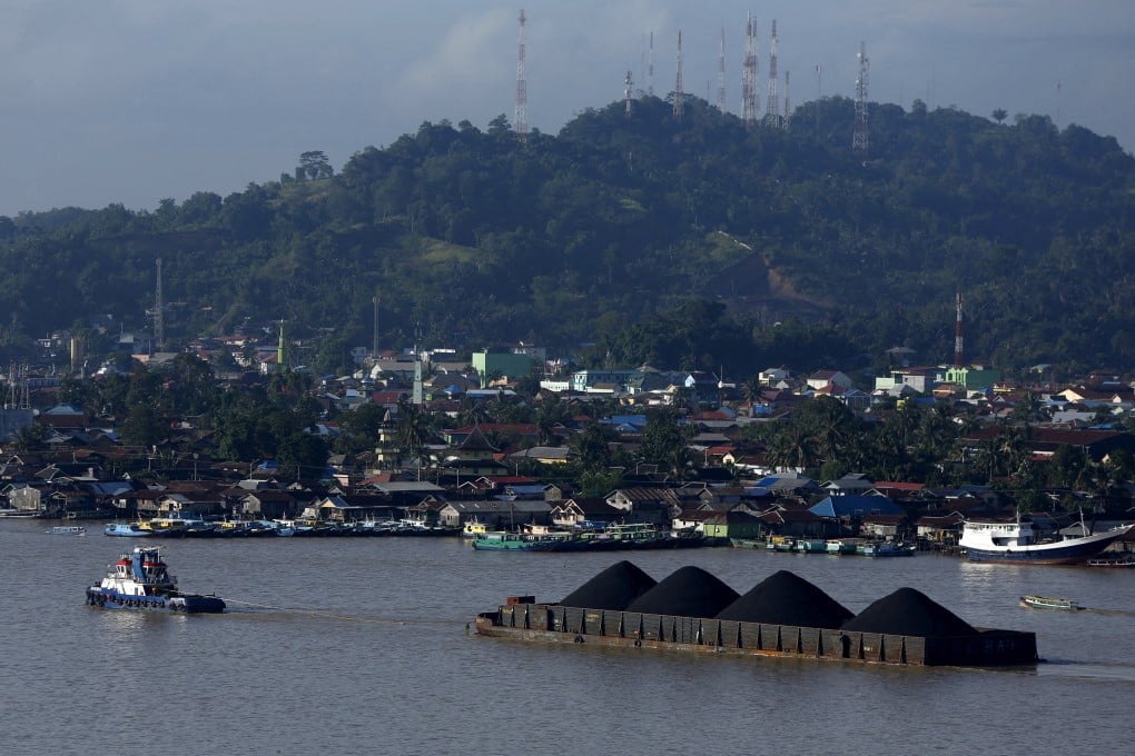 A tug boat pulls a coal barge in Indonesia. Photo: Reuters