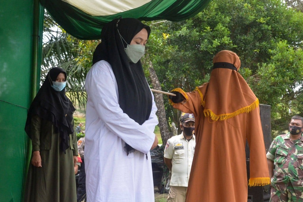 A woman is flogged 100 times for adultery in Idi, East Aceh. Photo: AFP
