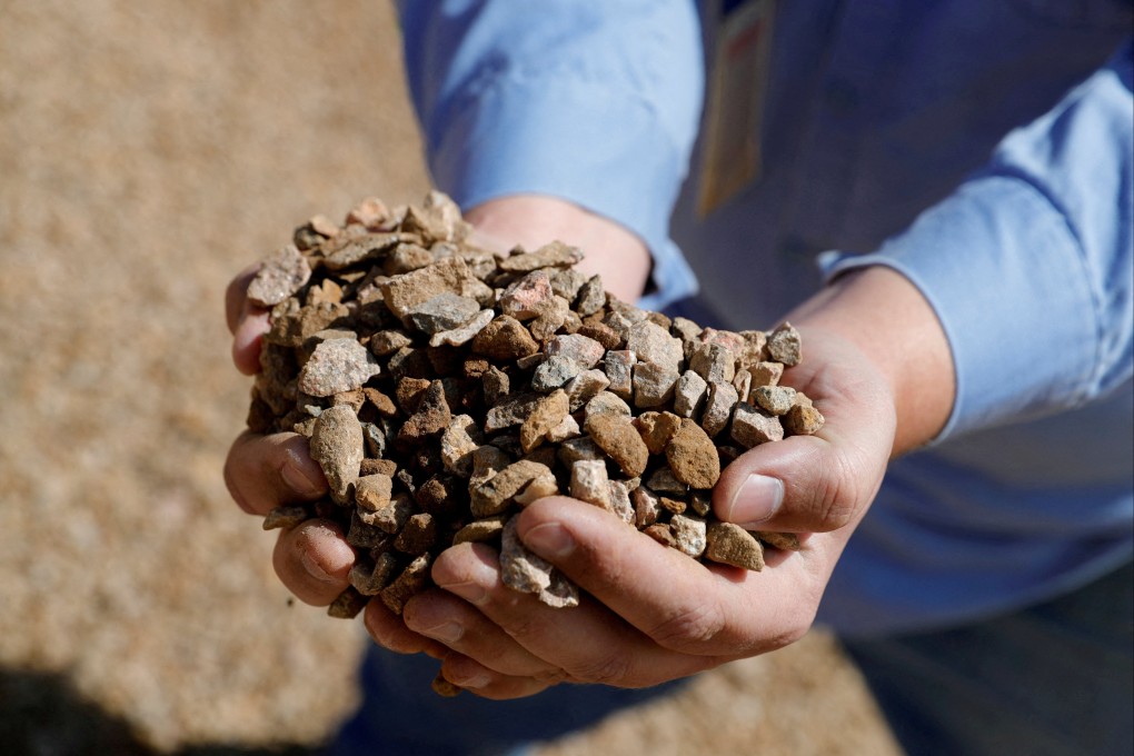 A supervisor displays crushed ore before it is sent to the mill at the MP Materials rare earth mine in Mountain Pass, California, the only such mine in the US. Photo: Reuters