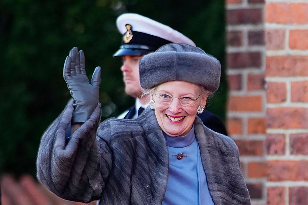 Queen Margrethe of Denmark waves after visiting the tomb of her father, Frederick IX, at Roskilde Cathedral on Friday. Photo: AFP