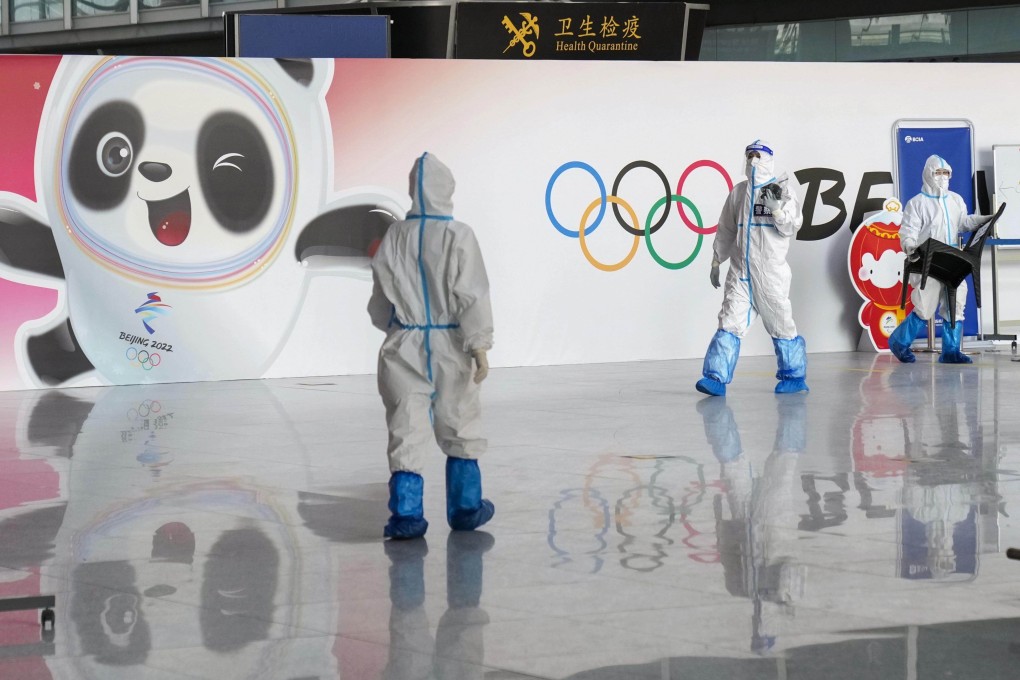 Officials wear protective gear at Beijing Capital International Airport amid Covid-19 fears as the city prepares to host the Winter Olympics. Photo: Kyodo