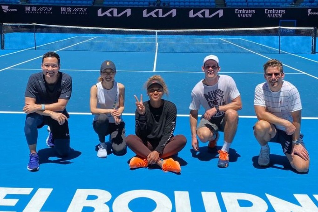 Reigning champion Naomi Osaka (centre) of Japan with team staff at a training session before the Australian Open in Melbourne. Photo: Handout