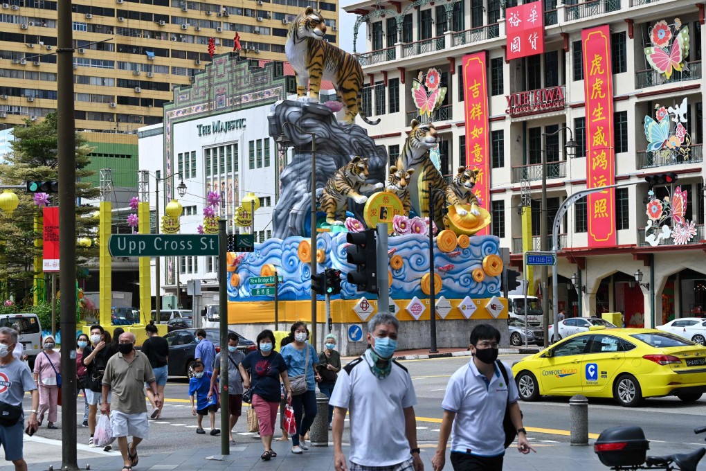 In Singapore, 87 per cent of the total population are fully vaccinated and 49 per cent have got booster shots. Photo: AFP