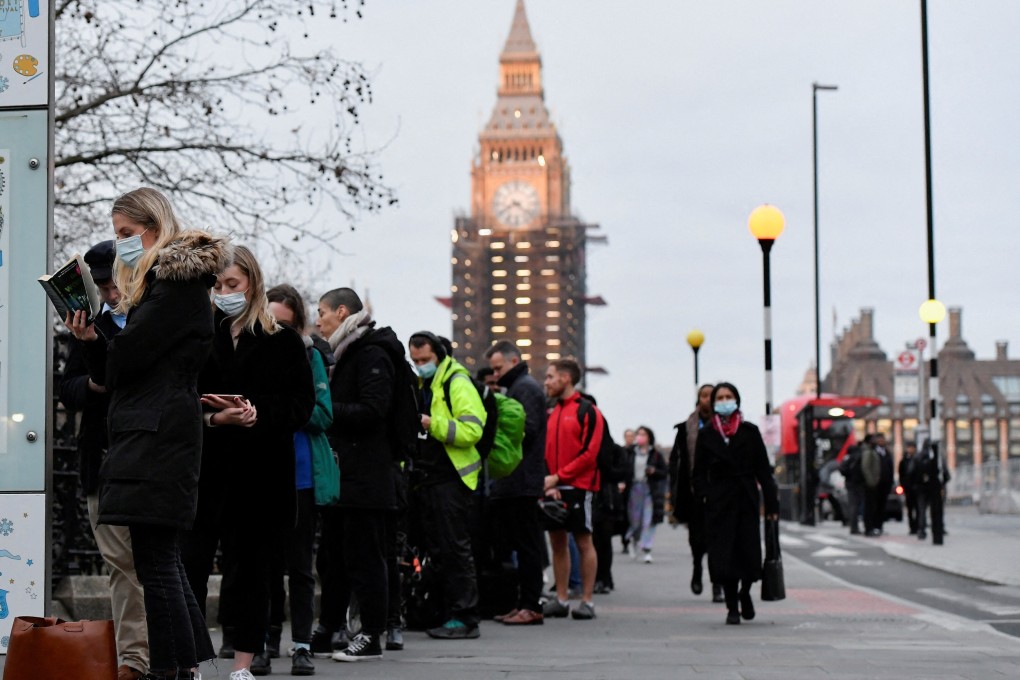 People queue at Westminster Bridge to receive Covid-19 vaccine and booster doses. Photo: Reuters