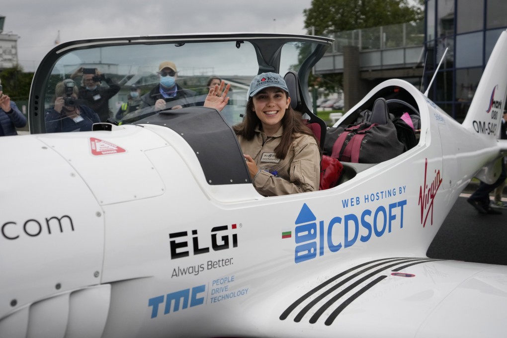 Zara Rutherford waves from her Shark ultralight plane at the Kortrijk-Wevelgem airfield in Belgium on August 18, 2021. File photo: AP