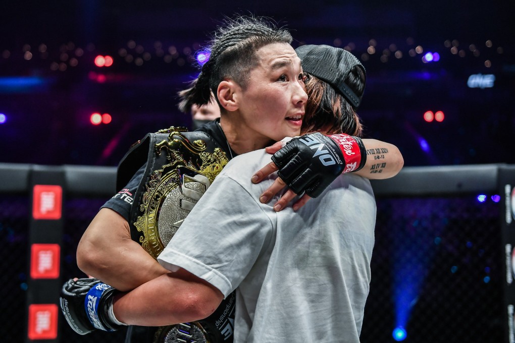 Xiong Jingnan hugs Ayaka Miura after beating her at ONE: Heavy Hitters. Photo: David Ash/ONE Championship