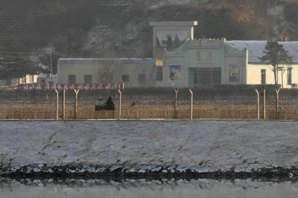 Photo taken from the Chinese city of Dandong in late December 2021 shows fences set along the Yalu River on the North Korean side. Photo: Kyodo