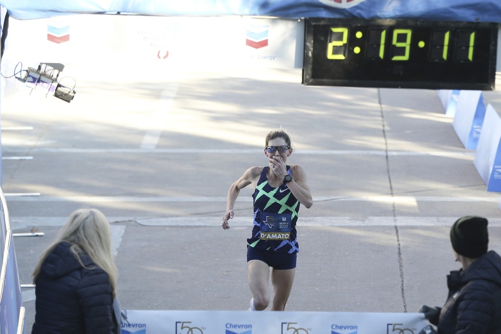 Keira D’Amato reacts to her time as she crosses the line for the Chevron Houston Marathon. Photo: AP