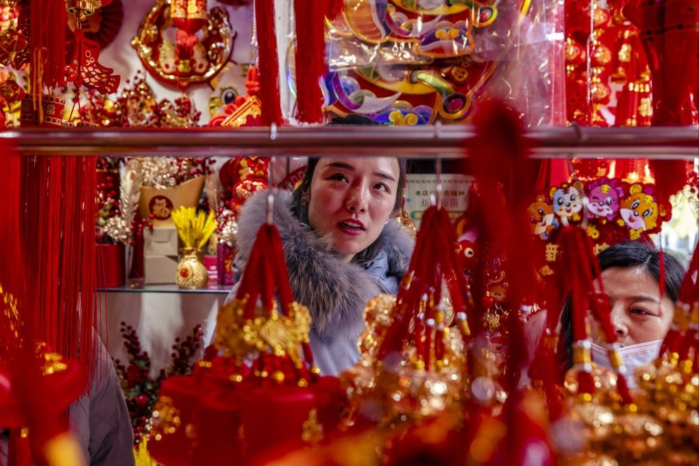 People buy Lunar New Year decorations at a shop in Shanghai on January 12. China’s economy grew 8.1 per cent in 2021, and is expected to expand at around 5 per cent in 2022. Photo: EPA-EFE