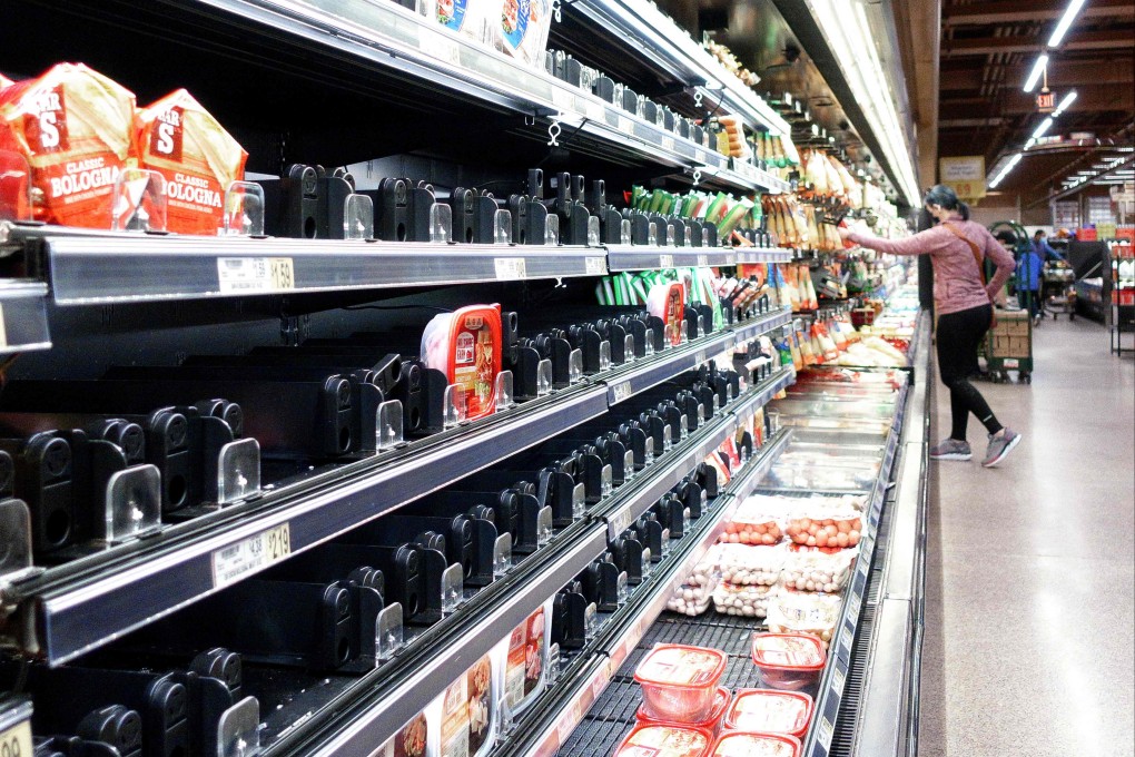 Shelves that held ham products are partially empty at a grocery store in Fairfax, Virginia, on January 13. Supply chain disruptions have helped to drive up inflation in the US. Photo: AFP
