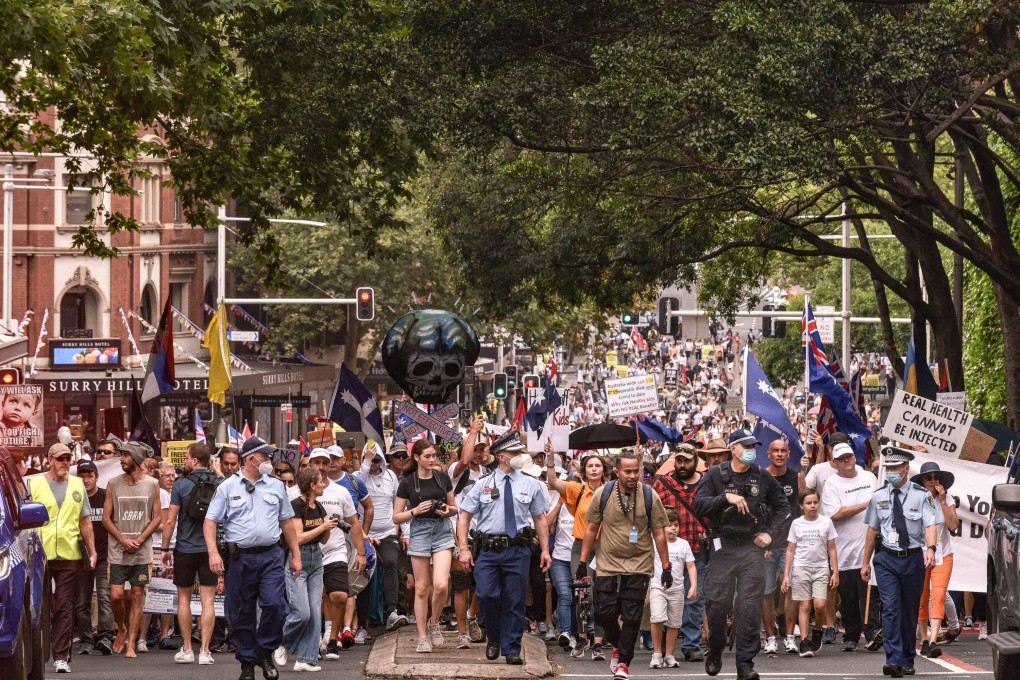 People march during a protest against vaccination policies in Sydney, Australia, on Saturday. Photo: EPA-EFE