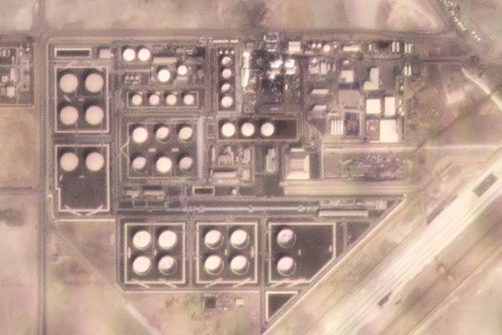 In this satellite image provided by Planet Labs, white fire suppressing foam is seen after an attack on an Abu Dhabi National Oil Co fuel depot. Photo: AP