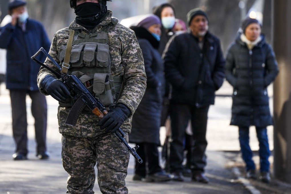 Relatives of arrested after anti-government protests gather near a police station in Almaty on January 14, 2022. Photo: AP