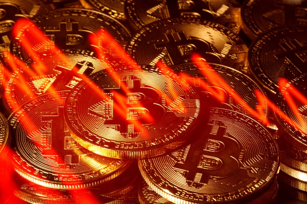 Illumination of the stock graph is seen on the representations of virtual currency Bitcoin in this picture illustration taken March 13, 2020. Photo: Reuters