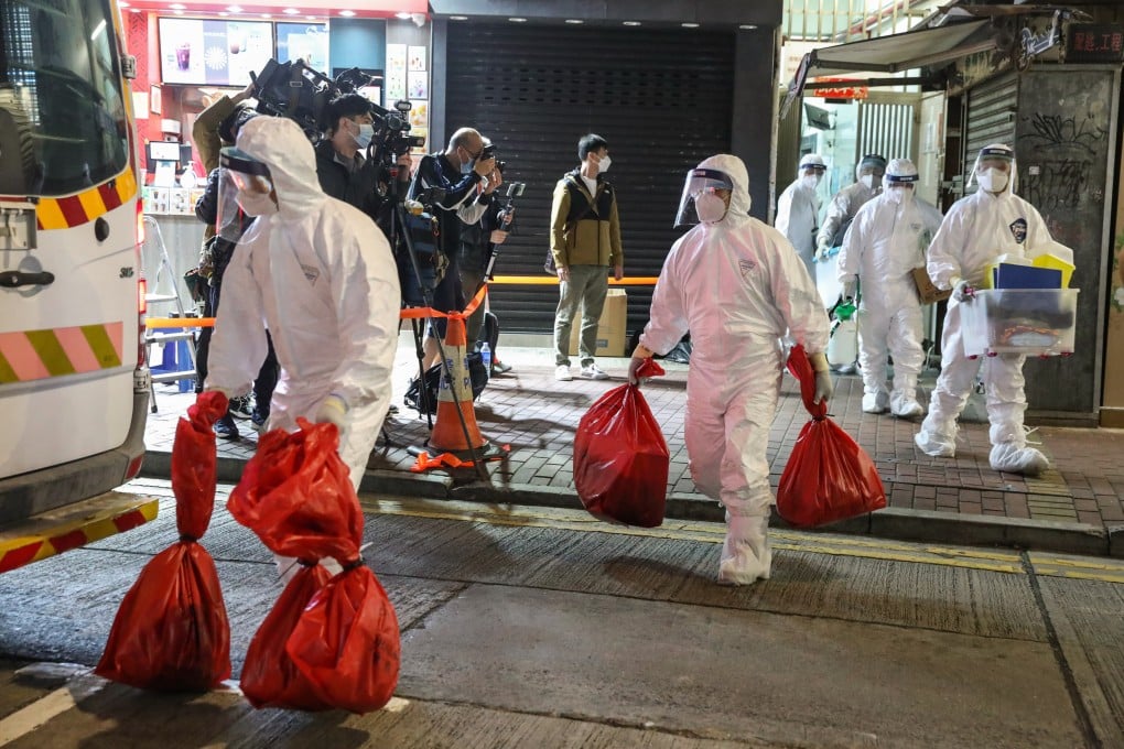 Workers with the Agriculture, Fisheries and Conservation Department take away hamsters from the Little Boss pet store in Causeway Bay on Tuesday. Photo: Edmond So