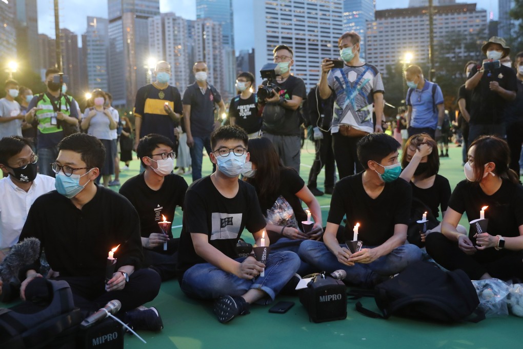 Opposition activist Joshua Wong (centre) at the banned Tiananmen Square vigil in 2020. Photo: Sam Tsang