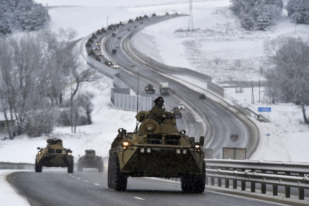 A convoy of Russian armoured vehicles moves along a highway in Crimea on Tuesday. Photo: AP