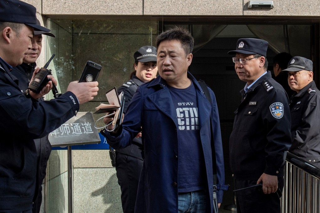 Xie Yang (centre) has been detained by police in central China after speaking out in defence of a local teacher. Photo: AFP