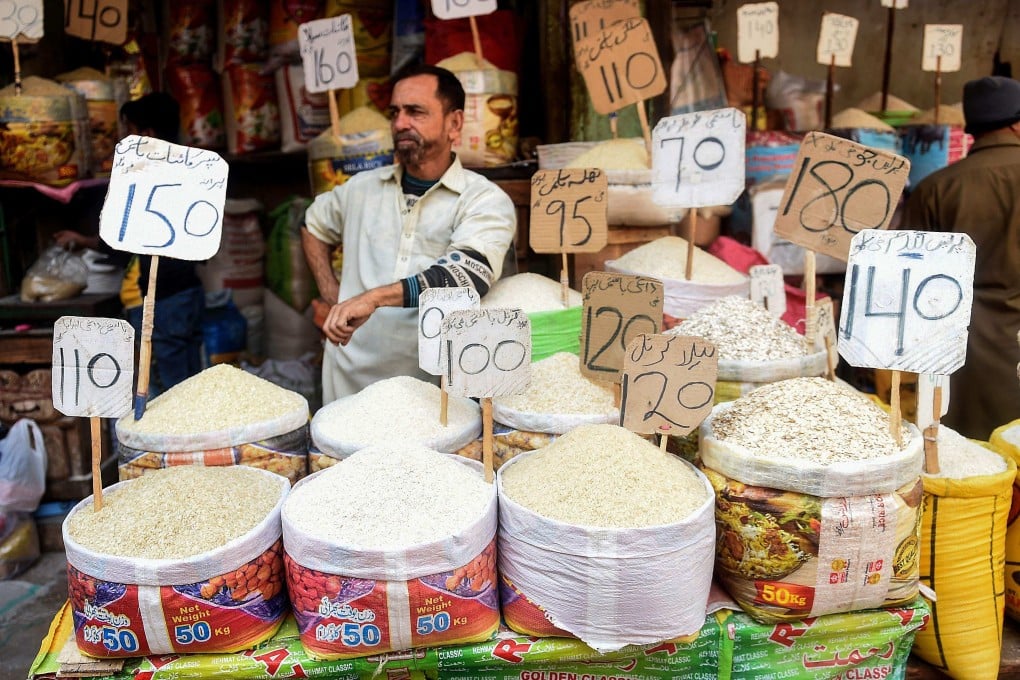 A shopkeeper waits for customers at a market in Karachi, Pakistan. Photo: AFP