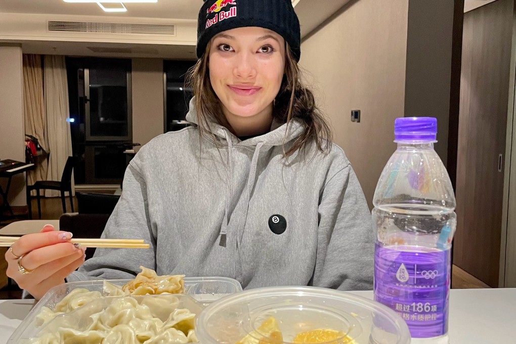 Eileen Gu eats dumplings in a Beijing restaurant after she arrives for the Winter Olympics. Photo: Weibo