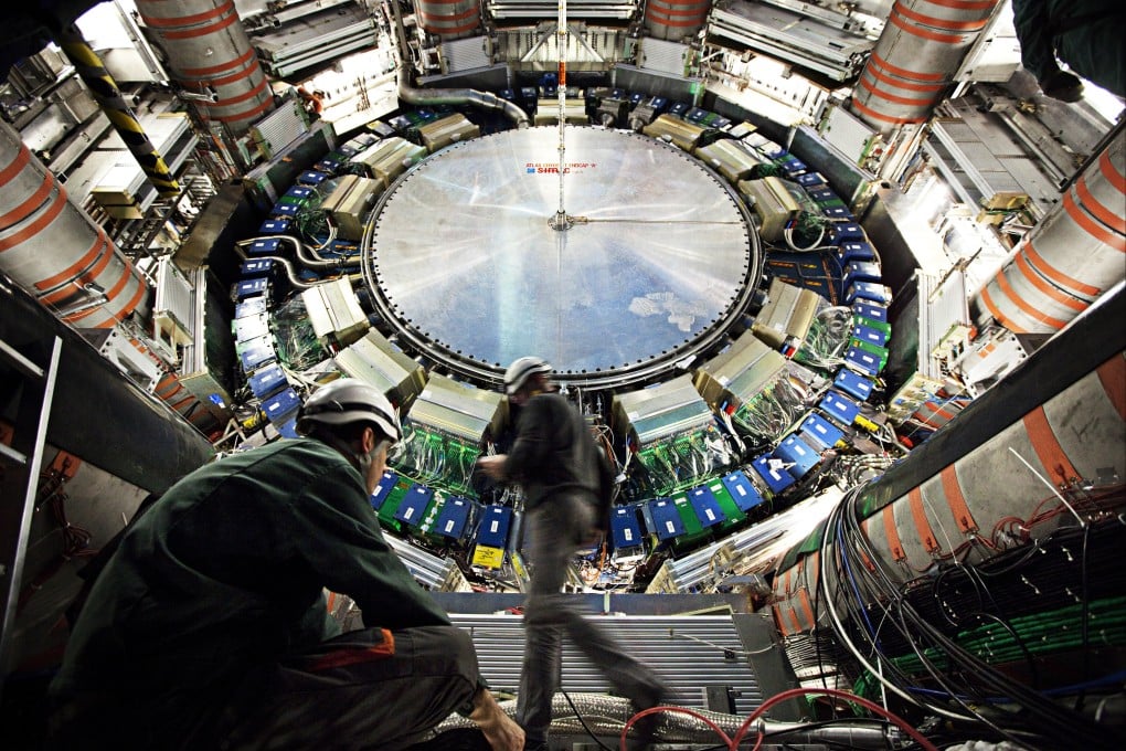 Scientists work on an experiment at CERN in Switzerland, a place akin to a time machine where they study the birth of the universe. Taking a CERN tour is a mind-boggling experience. Photo: CERN