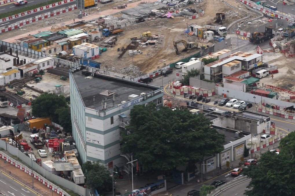 The Fleet Arcade in Wan Chai has been landlocked since reclamation of a section of Victoria Harbour in 2016 led to the closure of the adjoining Fenwick Pier where visting foreign naval ships docked. The  arcade will close in February. Photo: Roy Issa