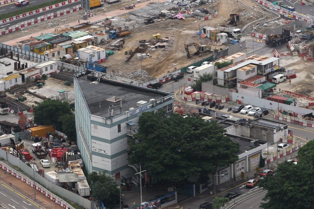 The Fleet Arcade in Wan Chai has been landlocked since reclamation of a section of Victoria Harbour in 2016 led to the closure of the adjoining Fenwick Pier where visting foreign naval ships docked. The arcade will close in February. Photo: Roy Issa
