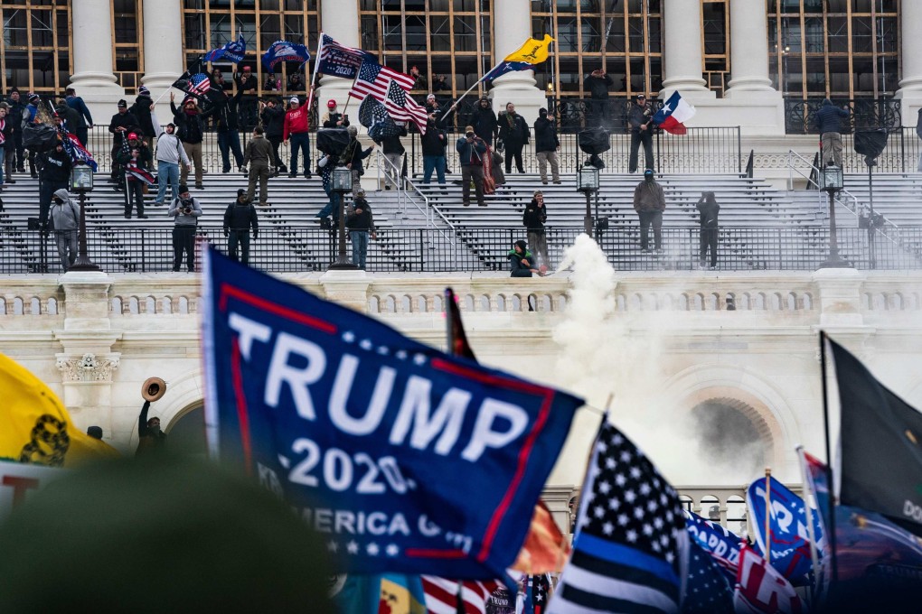 Supporters of US President Donald Trump clash with the Capitol police in Washington on January 6, 2021. Photo: TNS